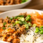 Ground turkey rice bowls topped with fresh veggies and drizzled with a creamy bang bang sauce.