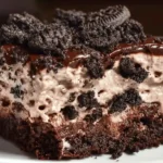 Classic dirt cake recipe with crushed Oreo cookie crumbs, creamy vanilla pudding filling, Cool Whip, and gummy worms on top