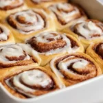Best homemade cinnamon rolls soft fluffy yeast dough with buttery brown sugar cinnamon filling and tangy cream cheese frosting