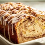 Classic layered cinnamon apple bread double cinnamon sugar filling beginner easy - cinnamon sugar half cup packed brown sugar 1.5 teaspoons cinnamon stirred set aside, 1 large apple Fuji Gala Granny Smith peeled chopped small pieces set aside, half cup softened salted butter two-third cup granulated white sugar mixer low-medium combined crumbly, 2 eggs 2 teaspoons vanilla added medium-low smooth no chunks, dry 1.5 cups all-purpose flour 1 teaspoon baking powder half teaspoon salt added, half cup milk slowly mixed just combined, half batter greased 9x5 pan half apples half cinnamon sugar repeated layers patted smooth baked 350°F 50-55 minutes toothpick clean rested 10 minutes sliced warm butter