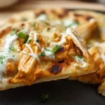 Homemade flatbread with creamy butter chicken, melted mozzarella cheese, fresh cilantro and spiced tomato sauce