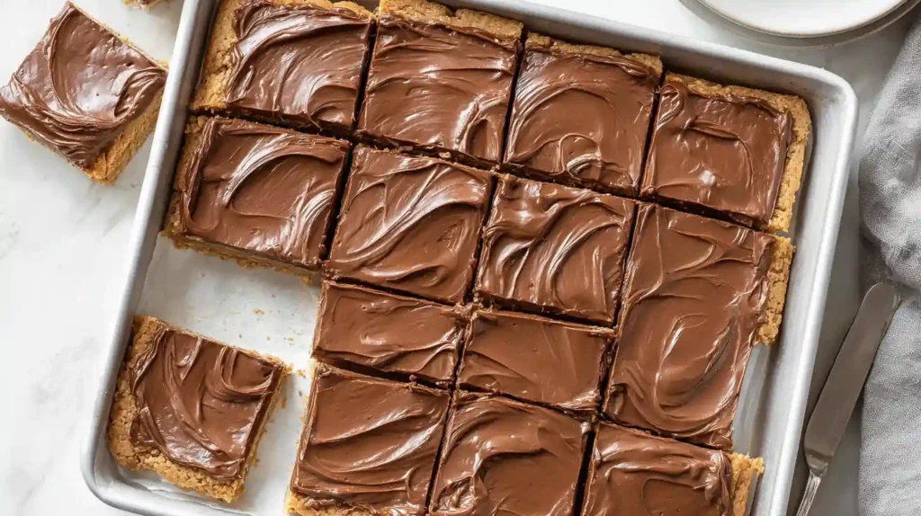 Lunch lady peanut butter bars no-bake retro school cafeteria dessert 15 minutes 9x9 pan — peanut butter base 1 cup salted butter cubed 1 cup creamy peanut butter microwave 50% power 30-second increments stirred smooth, 1 teaspoon vanilla added, 2 cups graham cracker crumbs 1.75 cups powdered sugar folded thick dough pressed parchment-lined 9x9 pan refrigerated, chocolate topping 1.5 cups milk or semisweet chocolate chips 2 teaspoons coconut oil microwaved 30-second intervals stirred smooth poured offset spatula spread even layer refrigerated 2 hours firm set 16 squares sliced served